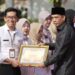 Alwi Apresiasi Dedikasi Tenaga Kesehatan dan Puskesmas Berprestasi di HKN 2025